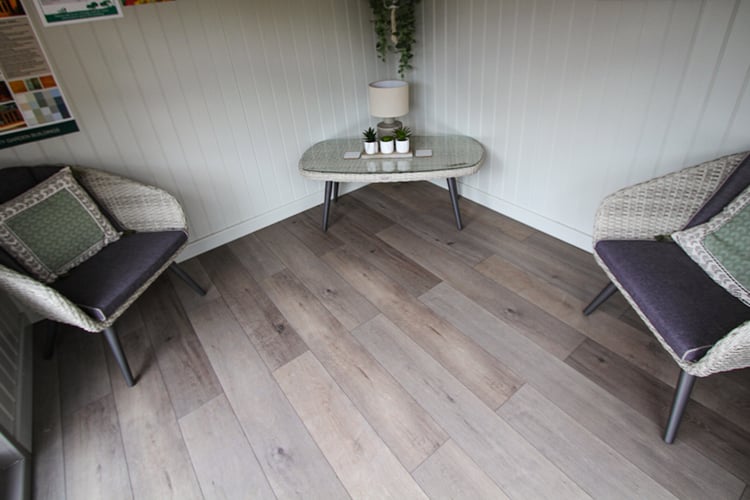 Wolfsback Oak deluxe laminate floor fitted to a Studio Corner
